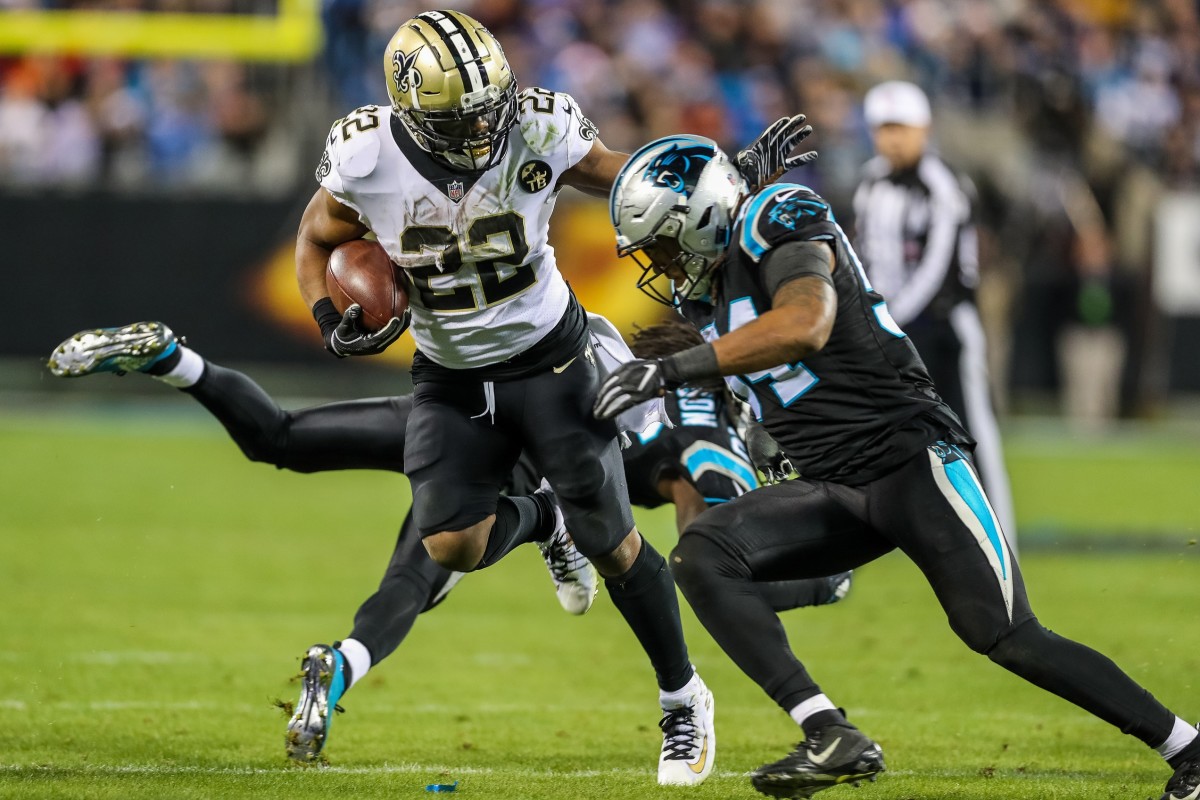 Dec 17, 2018; Carolina Panthers linebacker Shaq Thompson (54) tries to stop New Orleans Saints running back Mark Ingram (22). Mandatory Credit: Jim Dedmon-USA TODAY Sports